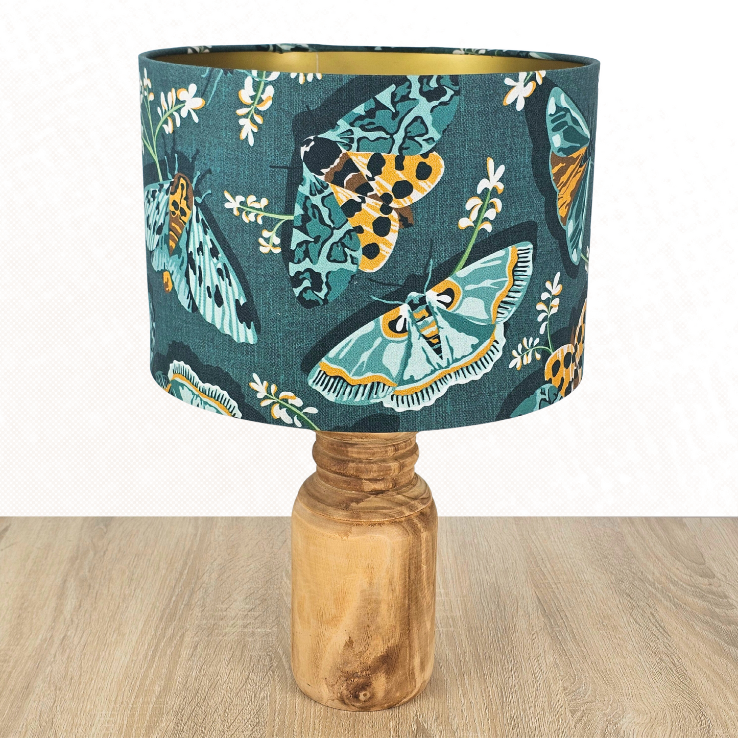 Lamp with a lampshade in emerald green with green and yellow moths