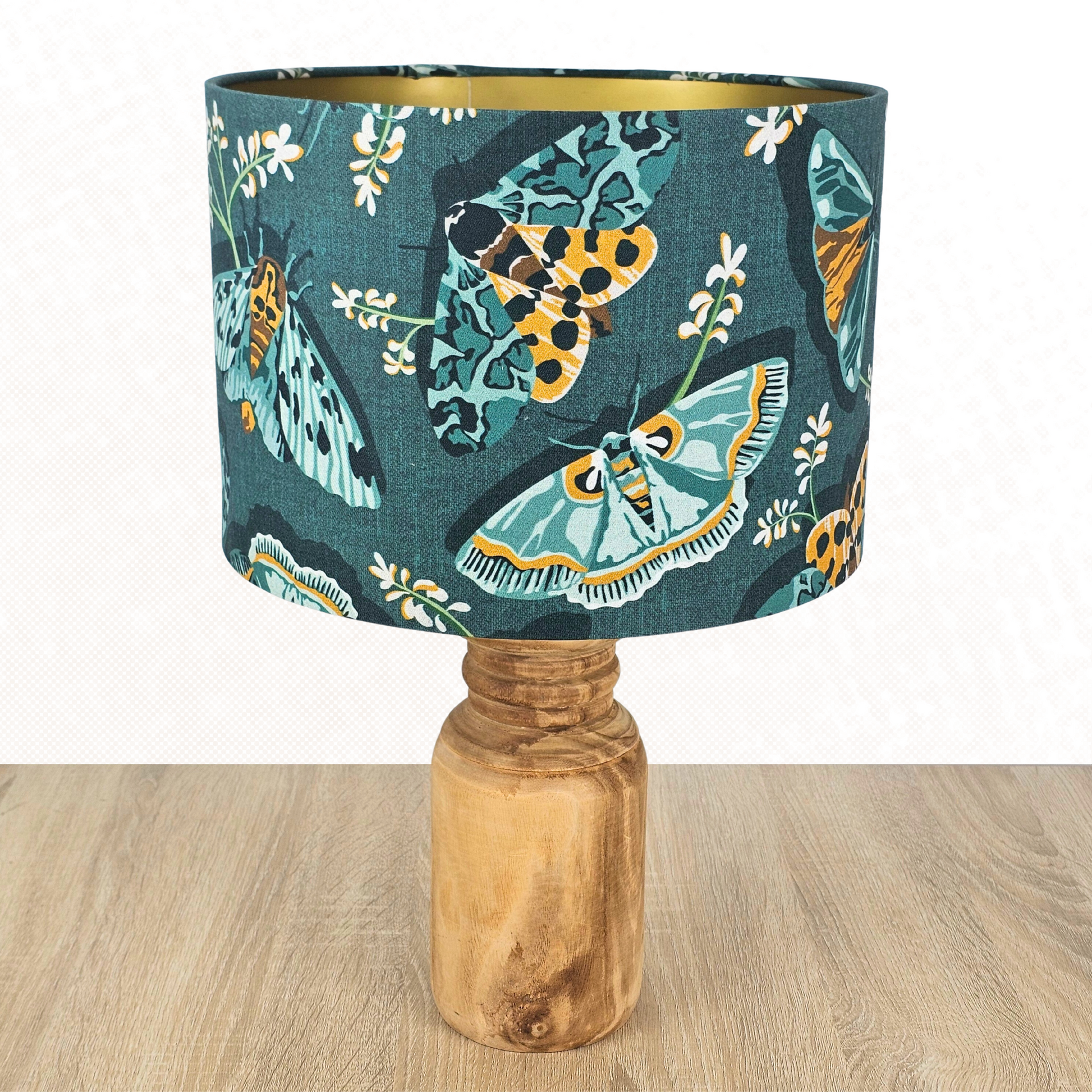 Lamp with a lampshade in emerald green with green and yellow moths